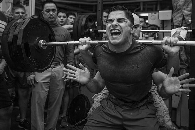 Marine Corps lightweight powerlifter completes a squat.