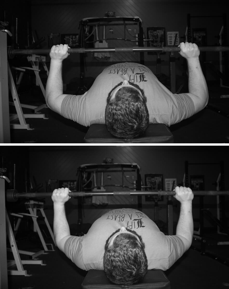 More tucked while elbows are still under the bar (bottom) = lower demands on the triceps